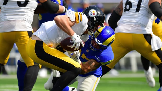 Oct 22, 2023; Inglewood, California, USA; Pittsburgh Steelers quarterback Kenny Pickett (8) is brought down by Los Angeles Rams linebacker Michael Hoecht (97) during the first half at SoFi Stadium. Mandatory Credit: Gary A. Vasquez-USA TODAY Sports